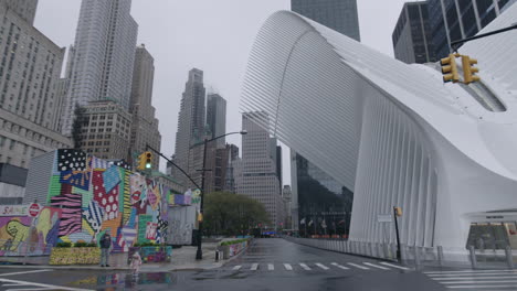 Oculus-downtown-Manhattan-and-a-man-and-his-daughter-on-a-rainy-day-during-covid-19