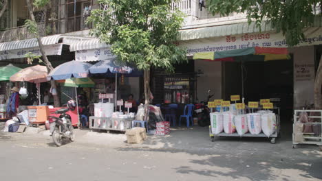 Outdoor-market-selling-rice-in-bulk-on-the-street-of-Phnom-Penh-wide-shot