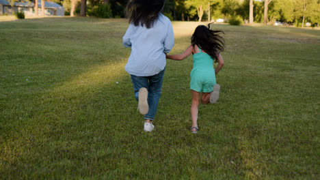 Mother-and-daughter-running-at-the-park