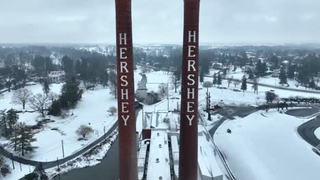 Aerial-flyover-between-industrial-smokestacks