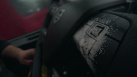 Macro-shot-of-spraying-the-wheel-buttons-of-a-wheel-Volvo-Semi-Truck