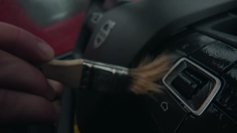 Macro-shot-of-brushing-the-wheel-buttons-of-a-wheel-Volvo-Semi-Truck