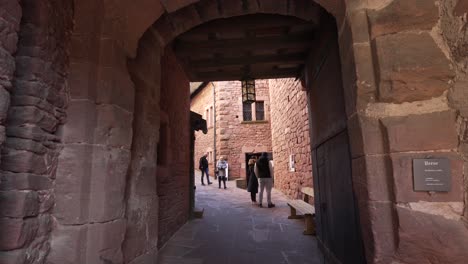 View-of-the-interior-of-the-beautiful-Haut-Koenigsbourg-Castle-chateau,-tourist-visitors-of-the-old-castle