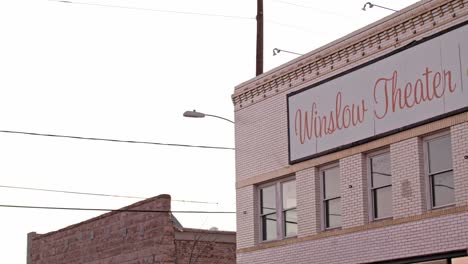 Winslow,-Arizona-Theatre-with-pan-down-to-street