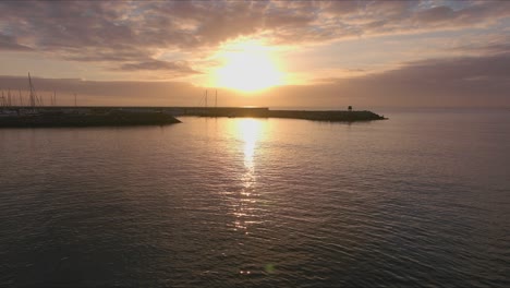 Drone-captures-tourist-silhouette-on-coast-at-Roc-de-Sant-Gaieta,-Tarragona