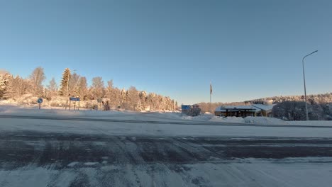 Winter-driving-awareness-POV,-icy-conditions-at-road-junction-scene