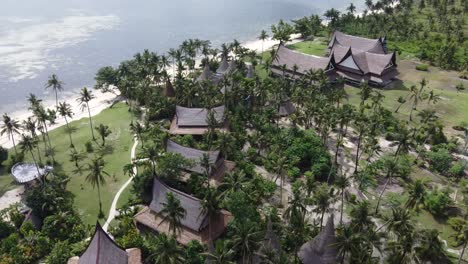 Traditional-villa-huts-of-Nay-Palad-hideout-resort-on-tropical-beach-in-General-Luna---Siargao