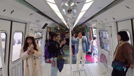 Visitors-inside-retired-train-cars-at-Victoria-Harbour