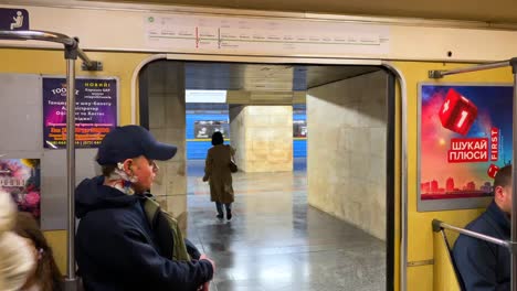 Doors-closing-on-the-underground-subway-metro-tube-in-Kyiv-Ukraine,-quick-transportation-around-a-city,-people-going-places,-4K-shot