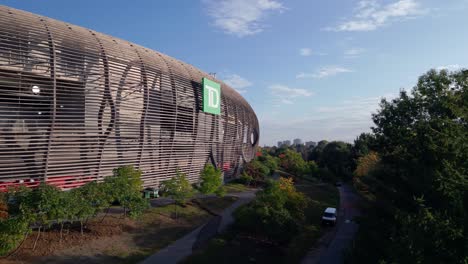 Exterior-of-toronto-dominion-football-stadium,-aerial-close-in-on-logo