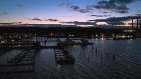 An-aerial-view-of-the-Port-Jefferson-ferry-departing-during-a-colorful-sunset-with-clouds