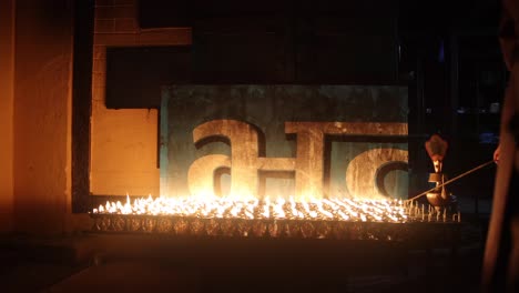 Religious-candlelight-flames-burning-in-Nepal-at-night