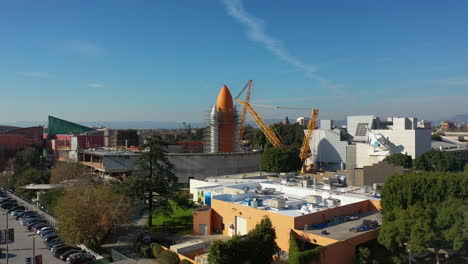 Drone-shot-rising-toward-a-space-rocket,-at-a-the-California-Science-Center-in-LA,-USA