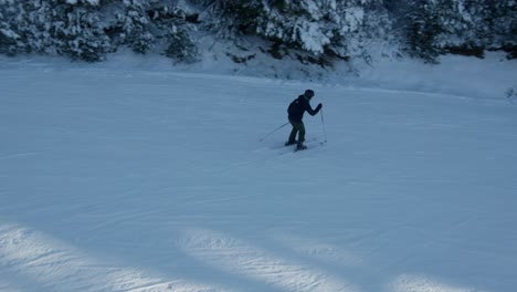 skier-and-snowboarder-sliding-slow-motion-snowy-slope-winter-resort