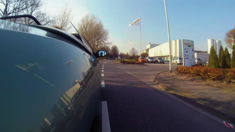 Car-mount-on-right-side-of-vehicle-with-late-afternoon-sunlight-ride-in-street