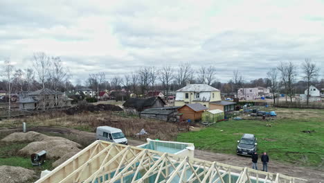 Aerial-Drone-Fly-Above-Architectural-Large-House-with-Wooden-Beams-Construction