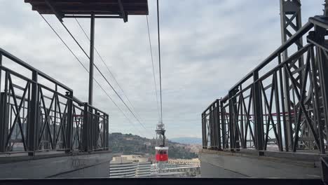 Outside-view-of-and-old-and-classic-red-cable-car-in-Barcelona,-Spain