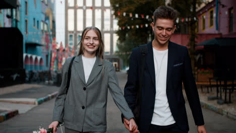 Teenage-boy-and-girl-holding-hands