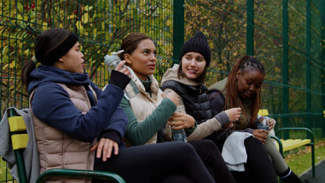 Women-sitting-on-a-bench-after-sports