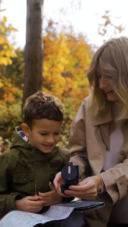 Mother-and-son-sitting-at-the-forest