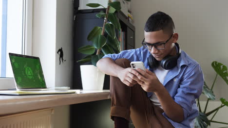 Boy-using-smartphone-at-home