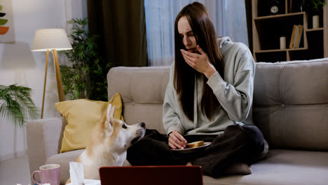 Woman-giving-food-to-dog