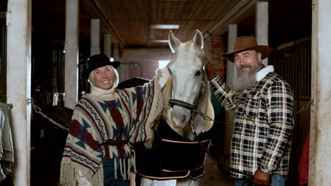 Couple-with-horse-indoors