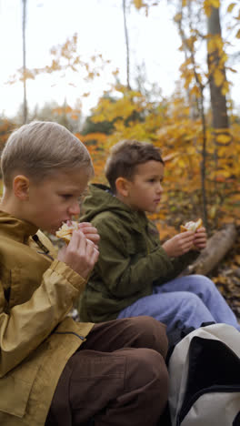 Kids-sitting-on-a-dead-tree