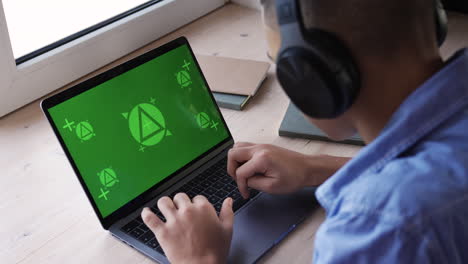 Boy-using-laptop-on-her-desk