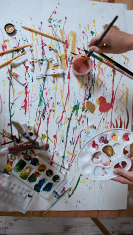 Artist-creating-an-abstract-painting