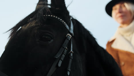 Closeup-woman-horseriding-at-the-farm