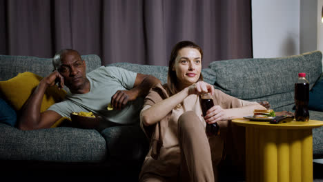Couple-watching-film-at-home