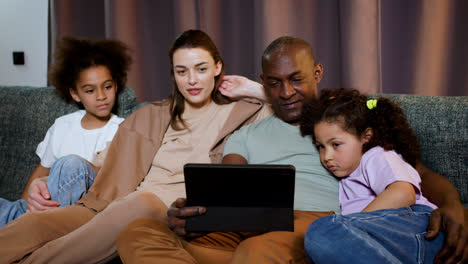 Family-watching-video-at-home