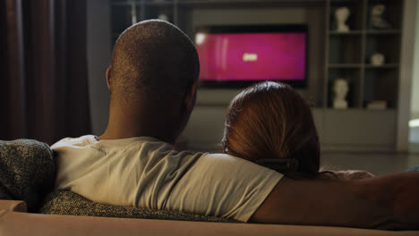 Couple-watching-TV-at-home