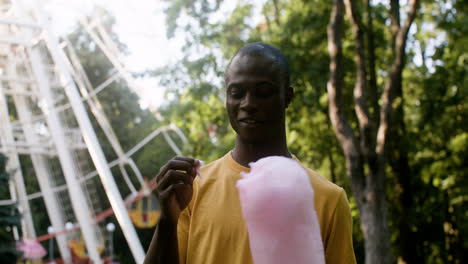 Young-man-eating-candy-floss