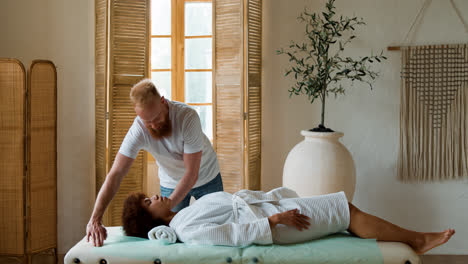Mam-preparing-the-room-for-the-massage