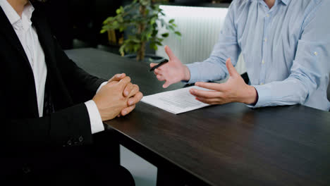 Caucasian-female-legal-advisor-hands-making-gestures-to-explain-a-customer-something-in-the-office