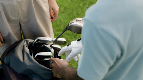 Close-up-view-of-golf-player's-hands-in-gloves.