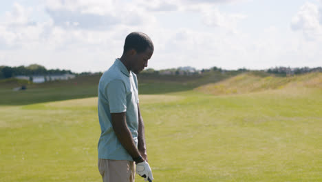 African-american-man-practicing-golf-on-the-golf-course.