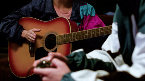 Young-person-playing-the-guitar