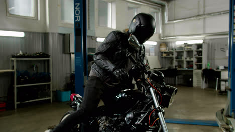 Rider-parking-his-motorcycle-at-the-garage