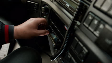 Man-setting-up-the-radio-on-a-truck