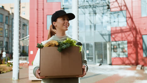 Courier-holding-box-outdoors