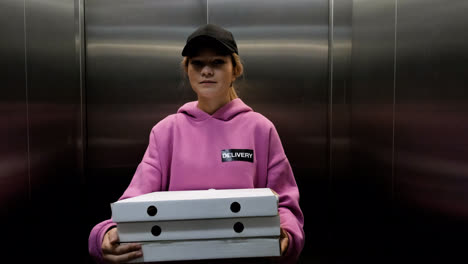 Delivery-woman-holding-carton-boxes