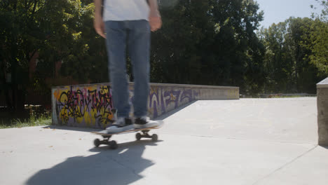 Boy's-feet-on-skateboard-in-skatepark.
