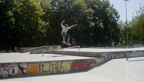 Caucasian-boy-doing-a-trick-in-skatepark.