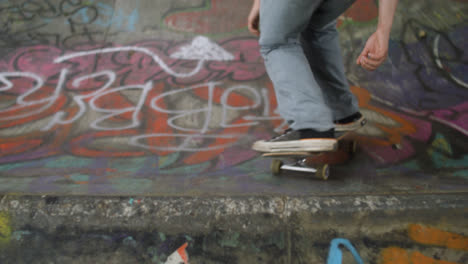 Boy's-feet-riding-on-skateboard-in-the-park.