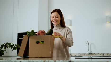 Woman-unpacking-vegetables