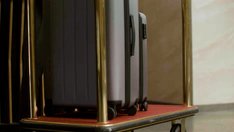 Bellhop-placing-luggage-on-a-hotel-cart