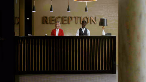 Receptionists-receiving-guests-at-the-hotel